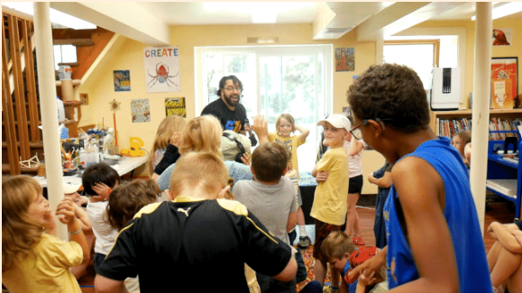 children watching a science performance